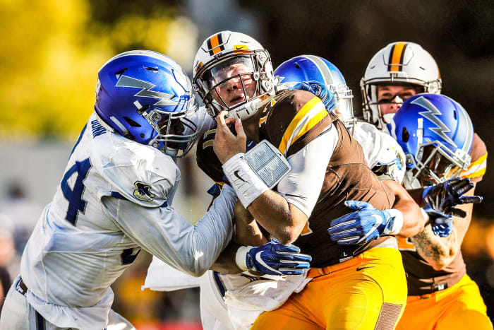 Josh Allen, playing at Wyoming, is sacked by Air Force defenders